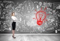Blond businesswoman and red light bulb sketch Royalty Free Stock Photo