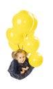 Blond caucasian little girl with yellow balloons