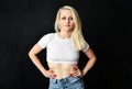 Charming blonde girl with uncovered belly Royalty Free Stock Photo