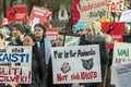 Blond caucasian woman hold no sign in her hand in the crowd of activists at Animal Advocacy protest