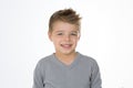 Blond cheerful kid on isolated background