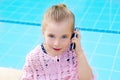 Blond child little girl talking mobile phone Royalty Free Stock Photo