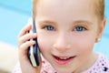 Blond child little girl talking mobile phone Royalty Free Stock Photo