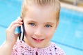 Blond child little girl talking mobile phone Royalty Free Stock Photo