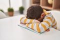 Blond child tired studying at home Royalty Free Stock Photo