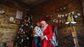 Santa Claus presents gift to happy boyr Royalty Free Stock Photo