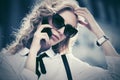 Blond fashion business woman in sunglasses calling on cell phone on city street Royalty Free Stock Photo