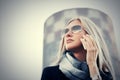 Blond fashion business woman in sunglasses talking on mobile phone Royalty Free Stock Photo