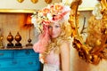 Blond fashion woman with spring flowers hat Royalty Free Stock Photo