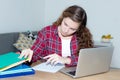 Blond female student learning at desk Royalty Free Stock Photo