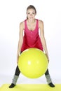 Blond fitness sport girl with ball Royalty Free Stock Photo