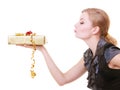 Blond girl in black dress holding red christmas gift box blowing kiss Royalty Free Stock Photo