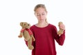 Blond girl with broken teddy bear