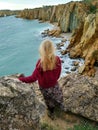 Blond girl on the cliffs