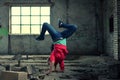 Blond girl dancing break dance in the old brickworks Royalty Free Stock Photo