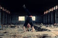 Blond girl dancing break dance in the old brickworks Royalty Free Stock Photo