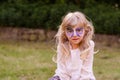 Blond girl with facepainting Royalty Free Stock Photo