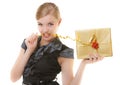 Blond girl with golden christmas gift box ribbon in teeth. Holiday. Royalty Free Stock Photo