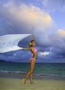 Blond girl in pink bikini and chiffon