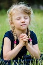 Blond girl praying Royalty Free Stock Photo