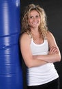 Blond Girl With Punching Bag Royalty Free Stock Photo