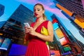 Blond girl red dress phone chat Times Square NYC Royalty Free Stock Photo