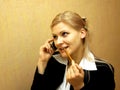 Blond girl talking by mobile phone Royalty Free Stock Photo