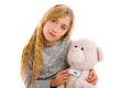 Blond girl with teddy bear thermometer and flu