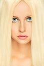 Blond hair woman with blue eyes. Retouched