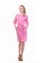 Blond haired business woman in summer pink dress