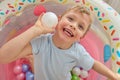 Bright photo of a happy child smiling while playing, looking at the camera. Royalty Free Stock Photo