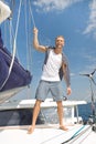 Blond handsome young man on sailing boat. Royalty Free Stock Photo