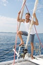 Blond handsome young man on sailing boat. Royalty Free Stock Photo