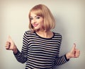 Blond happy smiling young woman showing thumb up sign by two han Royalty Free Stock Photo