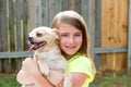 Blond kid girl with chihuahua pet dog playing Royalty Free Stock Photo