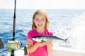 Blond kid girl fishing tuna bonito sarda fish happy catch Royalty Free Stock Photo