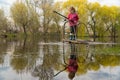 Blond kid girl fishing tuna little tunny happy with trolling catch on boat deck Royalty Free Stock Photo