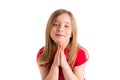 Blond kid girl praying hands gesture in white