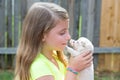 Blond kid girl with puppy pet chihuahua playing Royalty Free Stock Photo
