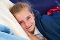 Blond kid girl tired relaxed smiling indented Royalty Free Stock Photo