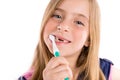 Blond kid indented girl cleaning teeth toothbrush