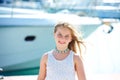 Blond kid teen girl in Mediterranean port Spain Royalty Free Stock Photo