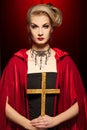 blond lady with a golden cross. Royalty Free Stock Photo