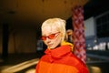 Closeup Of Androgyne Woman with red sunglasses