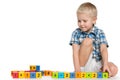 Blond little boy with blocks on the floor Royalty Free Stock Photo