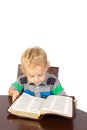 Blond little boy reading the bible Royalty Free Stock Photo