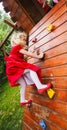 Blond little girl on a climbing wall Royalty Free Stock Photo