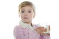 Blond little girl drinking glass of milk Royalty Free Stock Photo