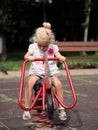 Blond little girl playing in the playground Royalty Free Stock Photo