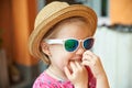 Blond little girl portrait finger in nose gesture Royalty Free Stock Photo